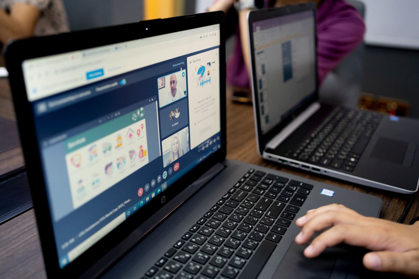 A video call in progress on a laptop screen
