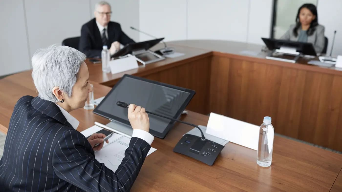 Senior colleagues in discussion in a boardroom