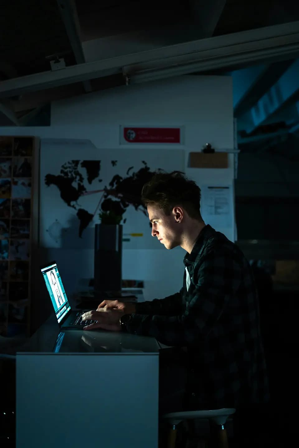 An engineer concentrating on a monitor