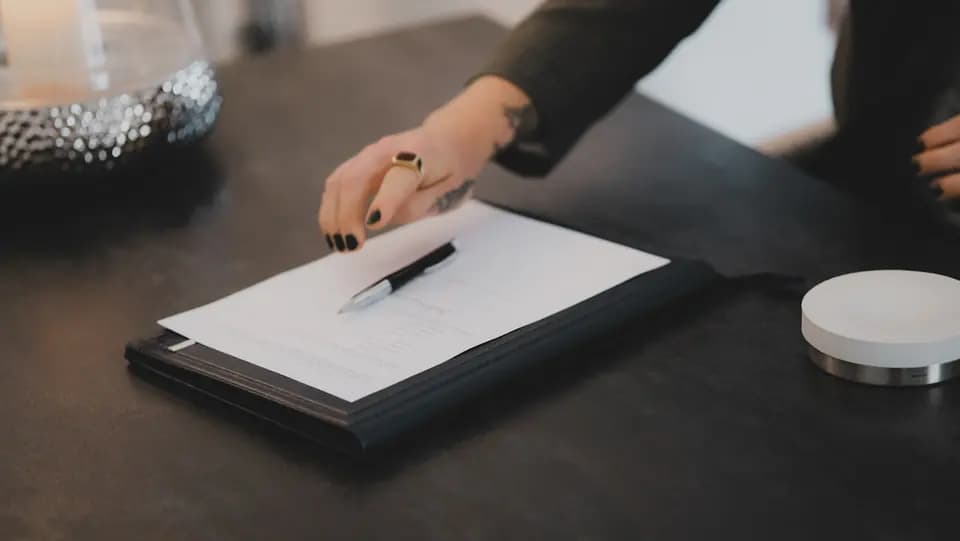 Notes being written onto a printed sheet