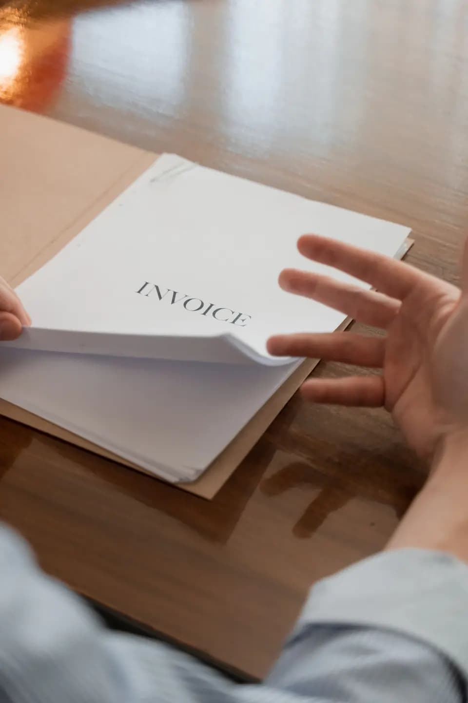Invoices being reviewed in an open folder