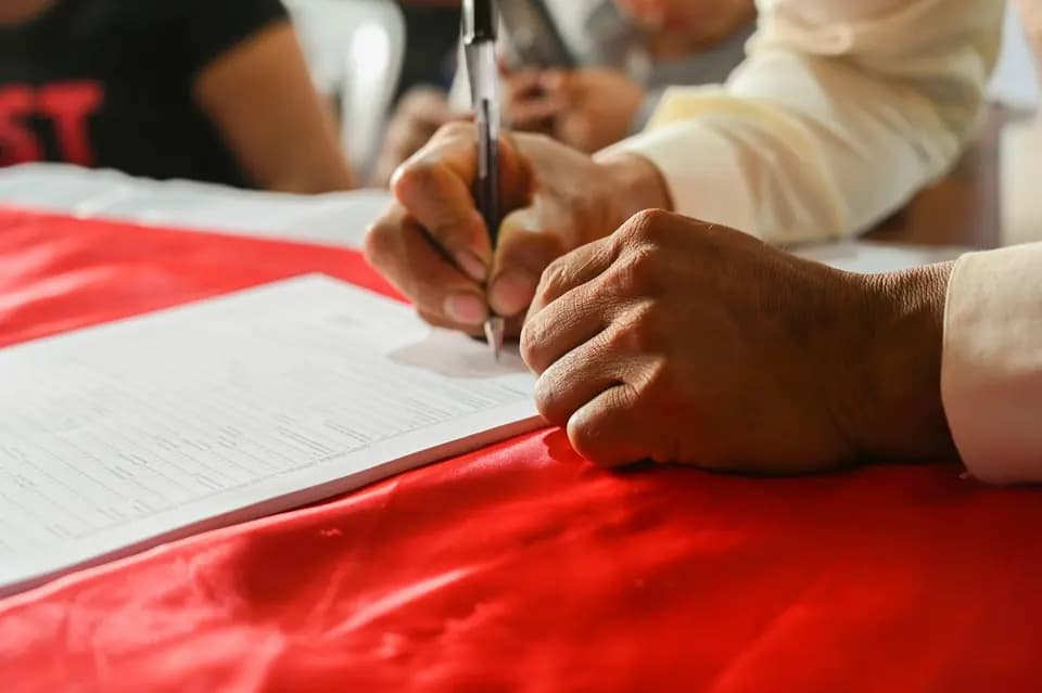 A record being signed off by hand