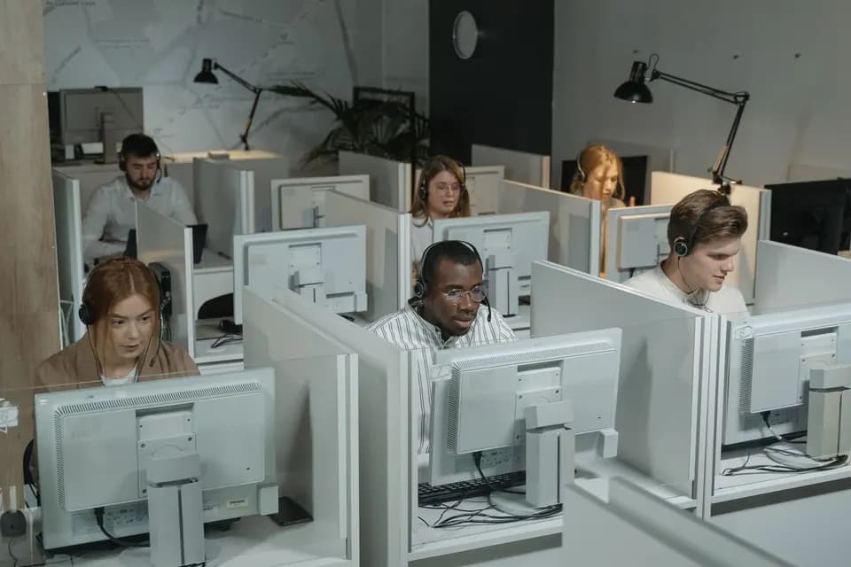 A support team working together in headsets